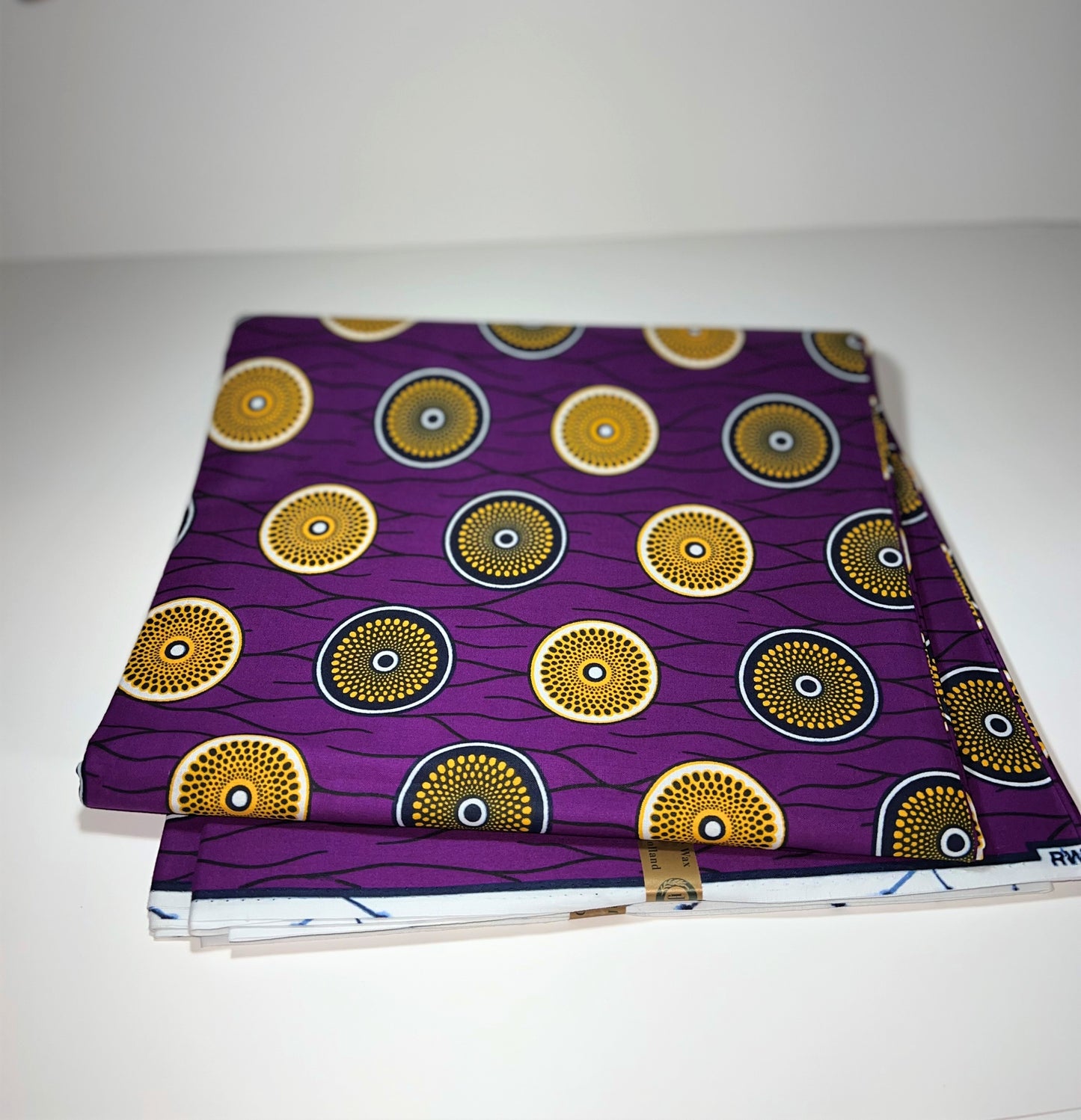 Purple Fabric with Gold & Black Circles